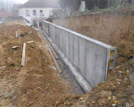 montage mur de soutenement blocs beton chantier